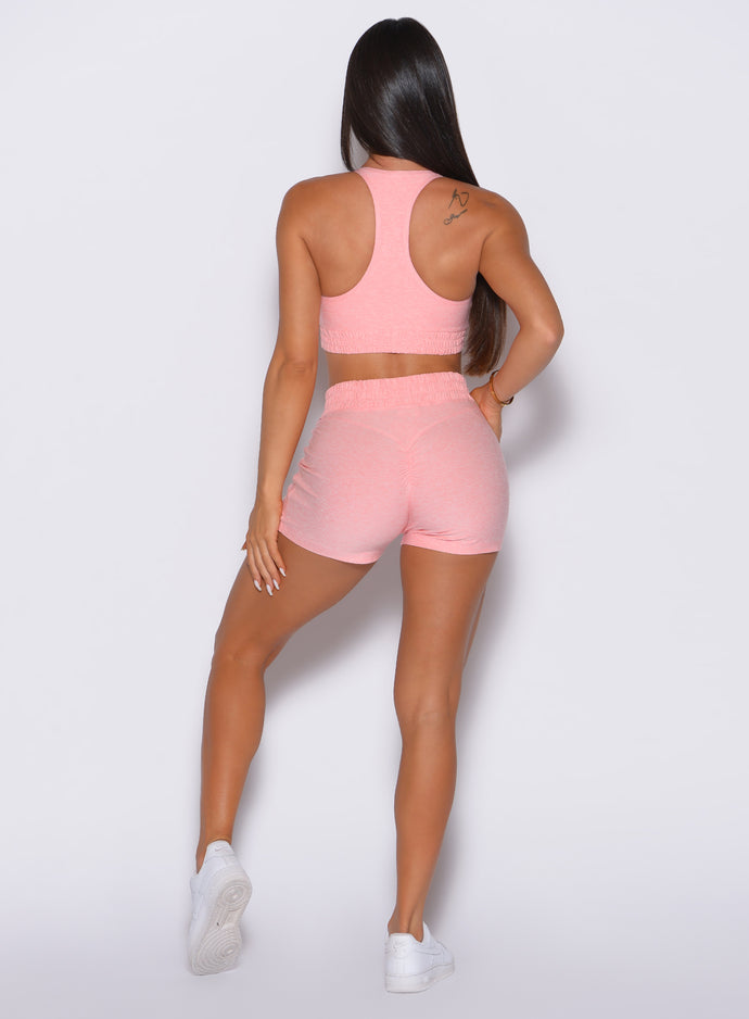 back profile view of a model wearing the Cloud Comfort Shorts in Peachy pink color