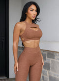 front right side profile view of a model in outdoors wearing the Powerhouse bra in Coffee Bean color