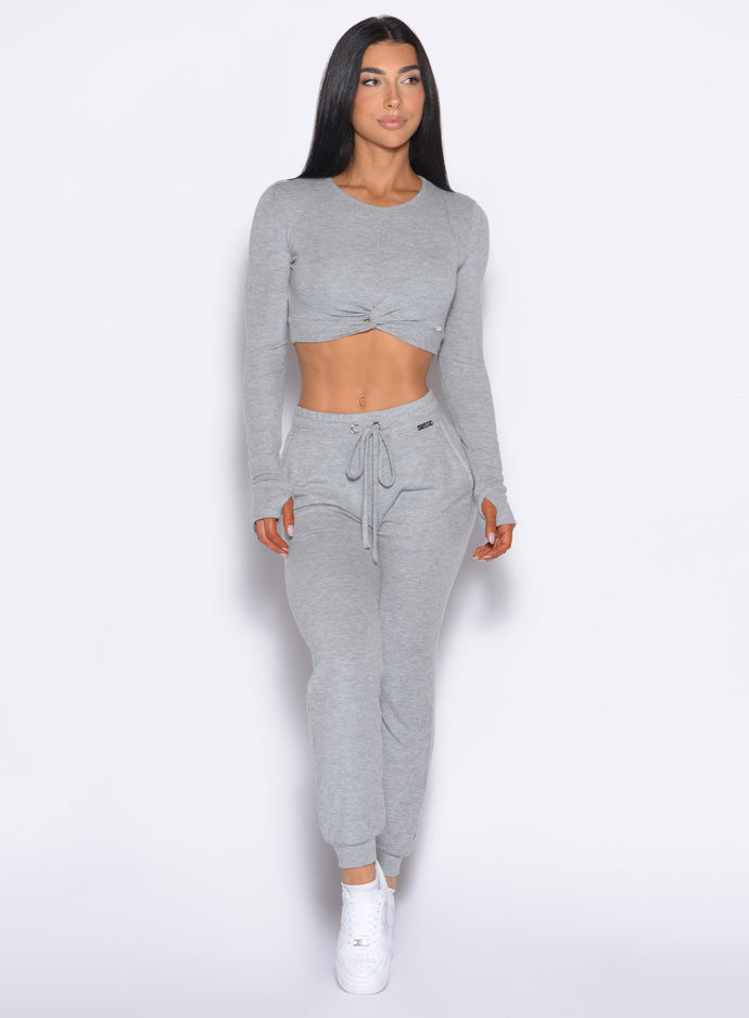 front profile view of a model looking to the left side wearing the Cuddle Up Joggers in Cozy Silver color