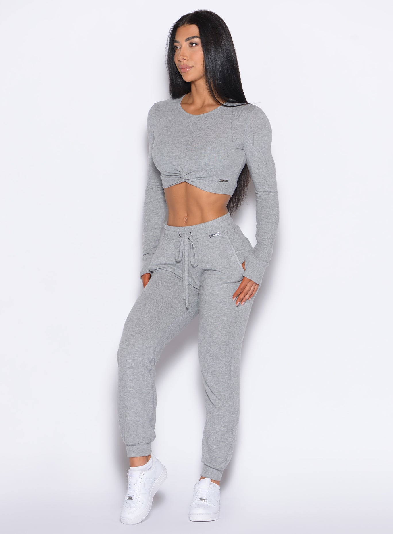 front left side profile view of a model wearing the Cuddle Up Joggers in Cozy Silver color