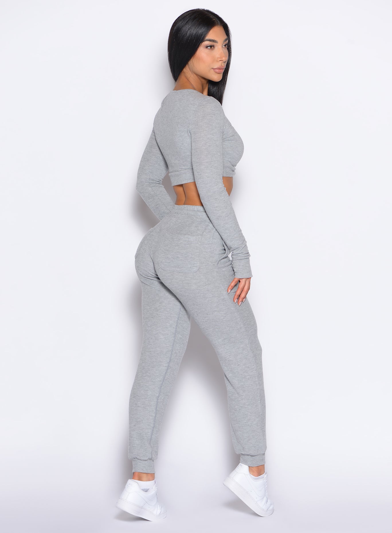 right back side profile view of a model wearing the Cuddle Up Joggers in Cozy Silver color