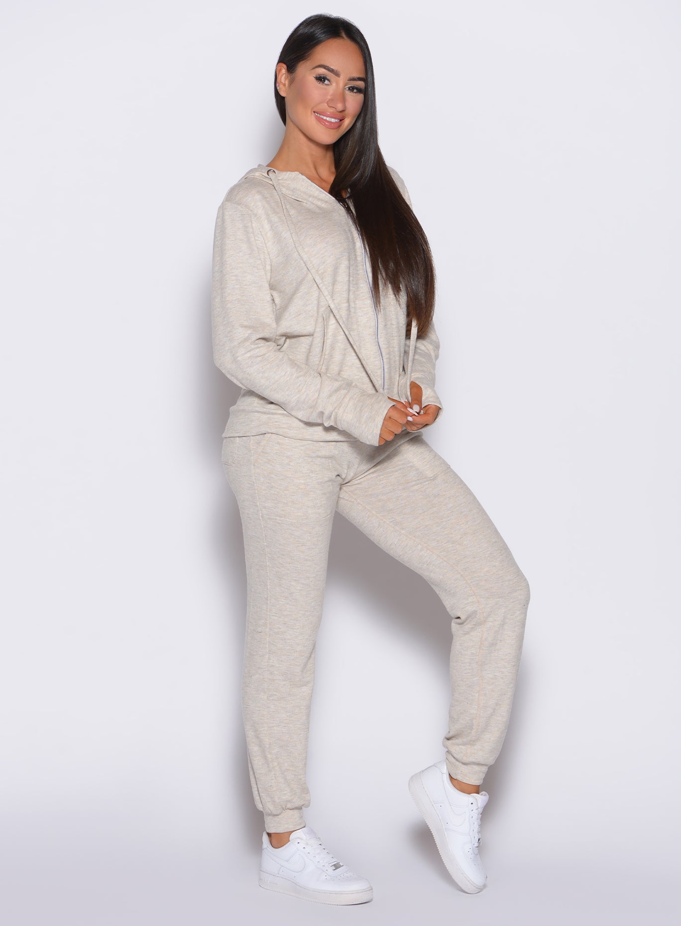 front right side profile view of a model wearing the Cuddle Up Joggers in Cozy Oat color