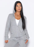 front profile view of a model looking to the left side wearing the Gym Crush Hoodie in Cozy Silver color