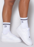 right side view of Bombshell Sportswear white crew socks 