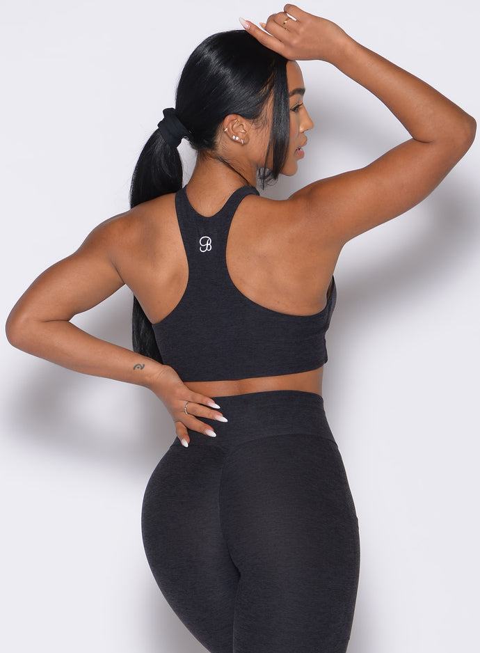 Zoomed in back side view of our Cross Over Halter Bra and the matching leggings in Heathered Black color
