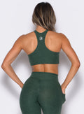 Zoomed in back side view of our Cross Over Halter Bra and the matching leggings in Pine color
