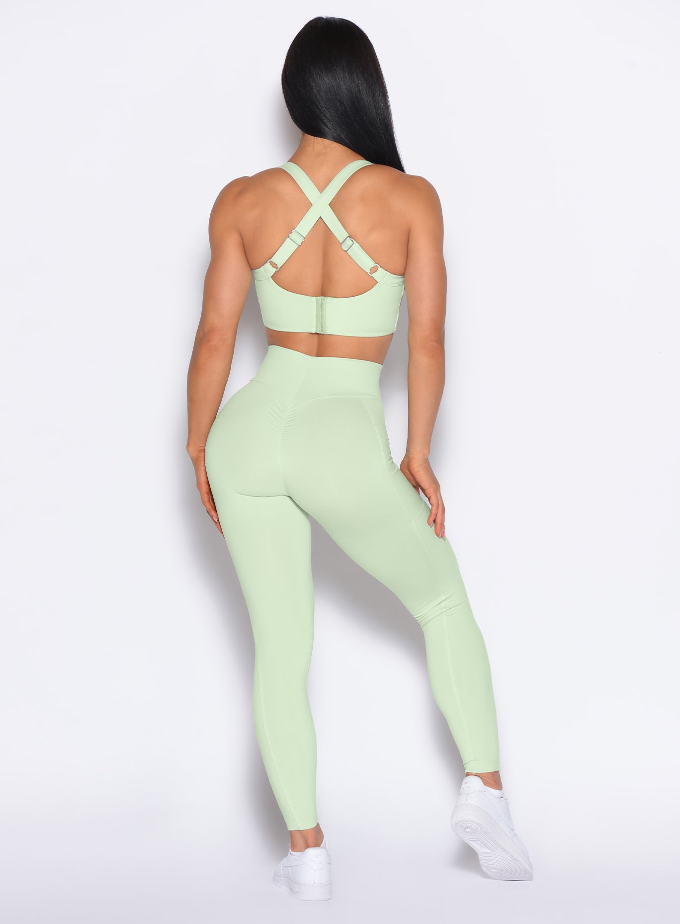 back profile view of our model wearing the Curves 2.0 Leggings in Cool Matcha color