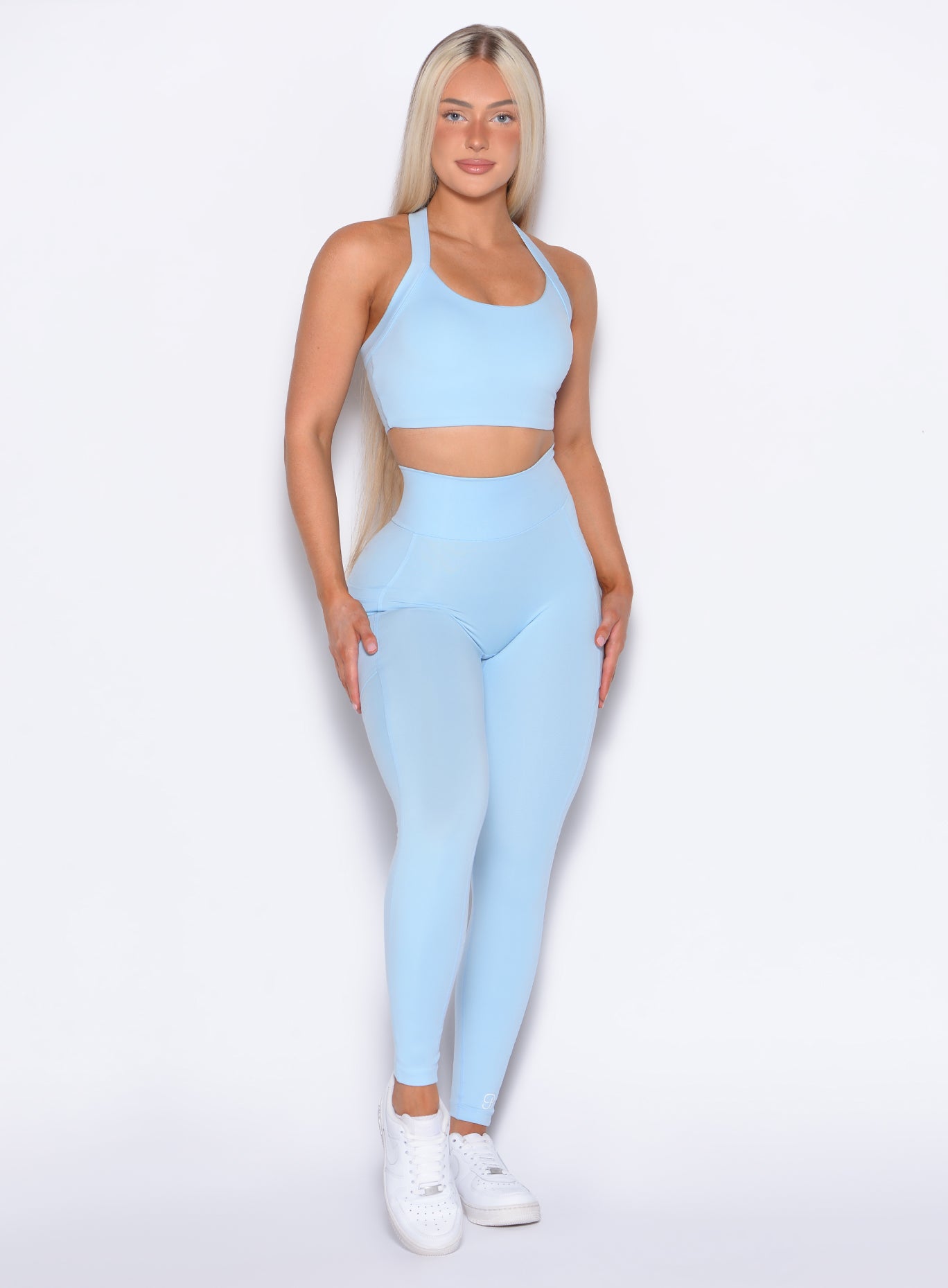 front profile view of our model wearing the Curves 2.0 Leggings in Glacial Blue color