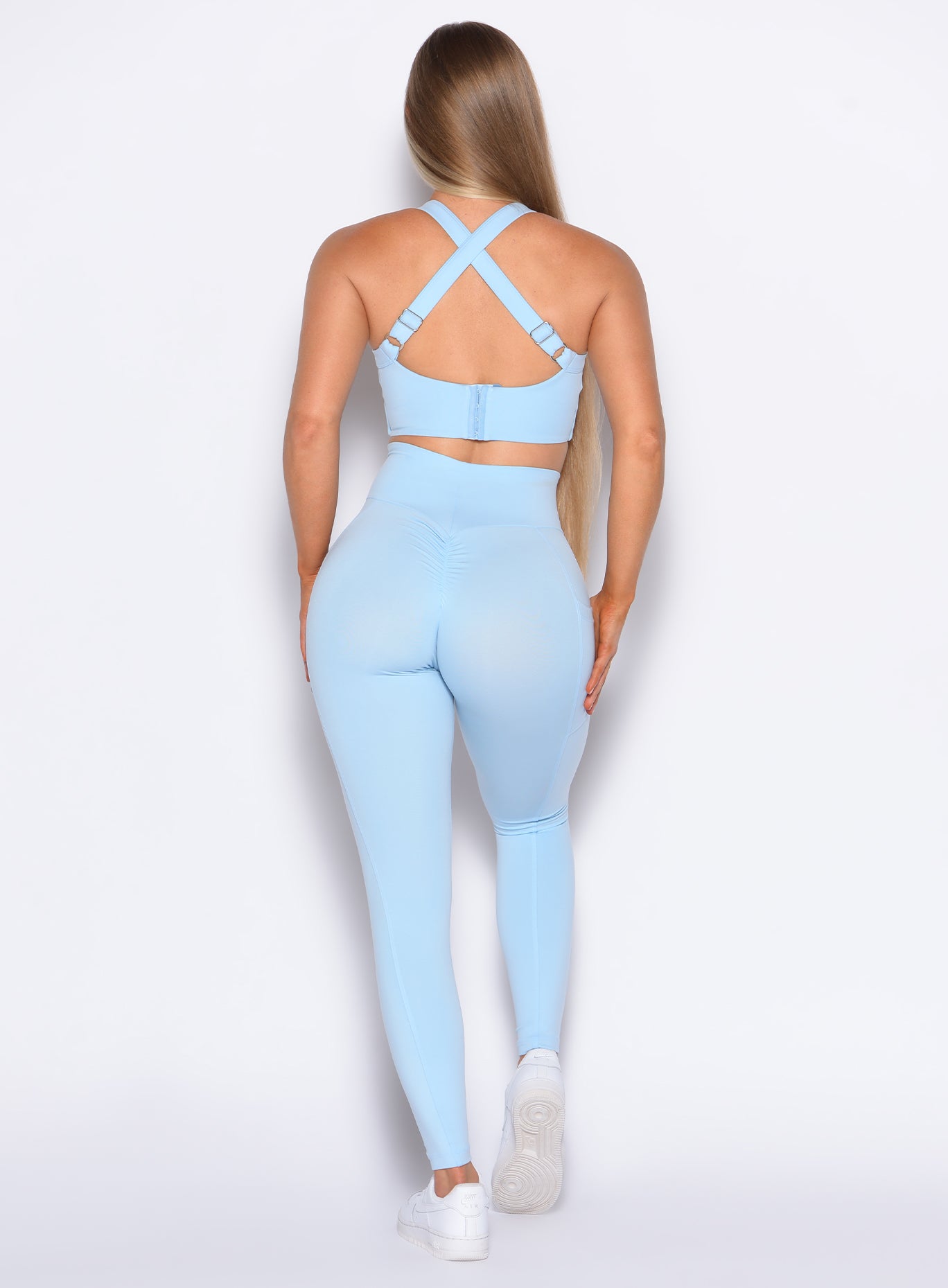 back profile view of our model wearing the Curves 2.0 Leggings in Glacial Blue color