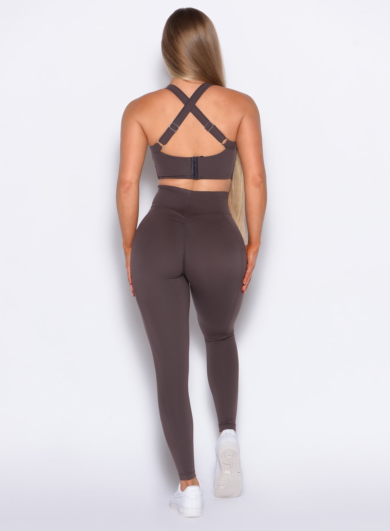 back profile view of our model wearing the Curves 2.0 Leggings in Seal Brown color