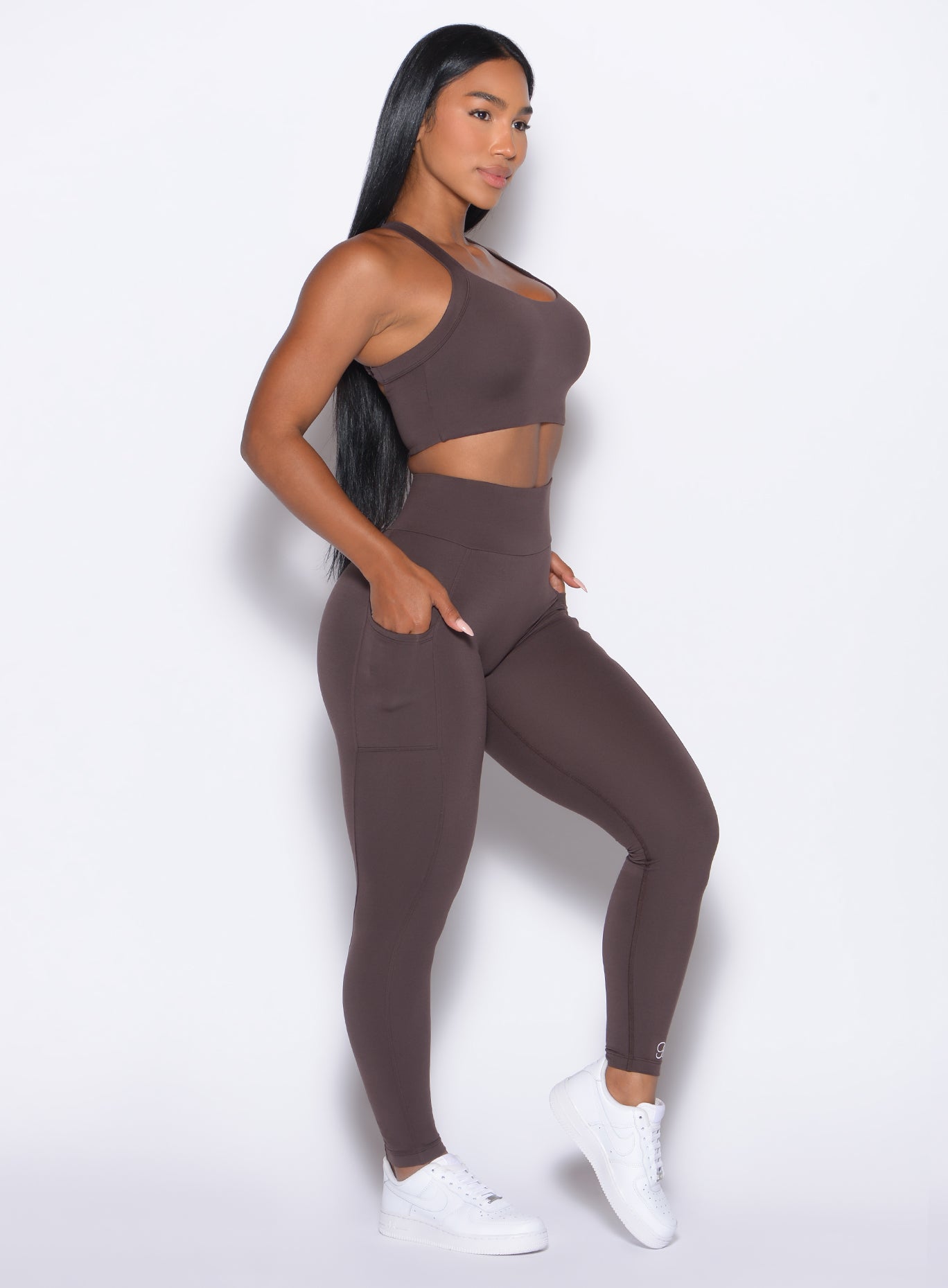 right side profile view of our model wearing the Curves 2.0 Leggings in Seal Brown color