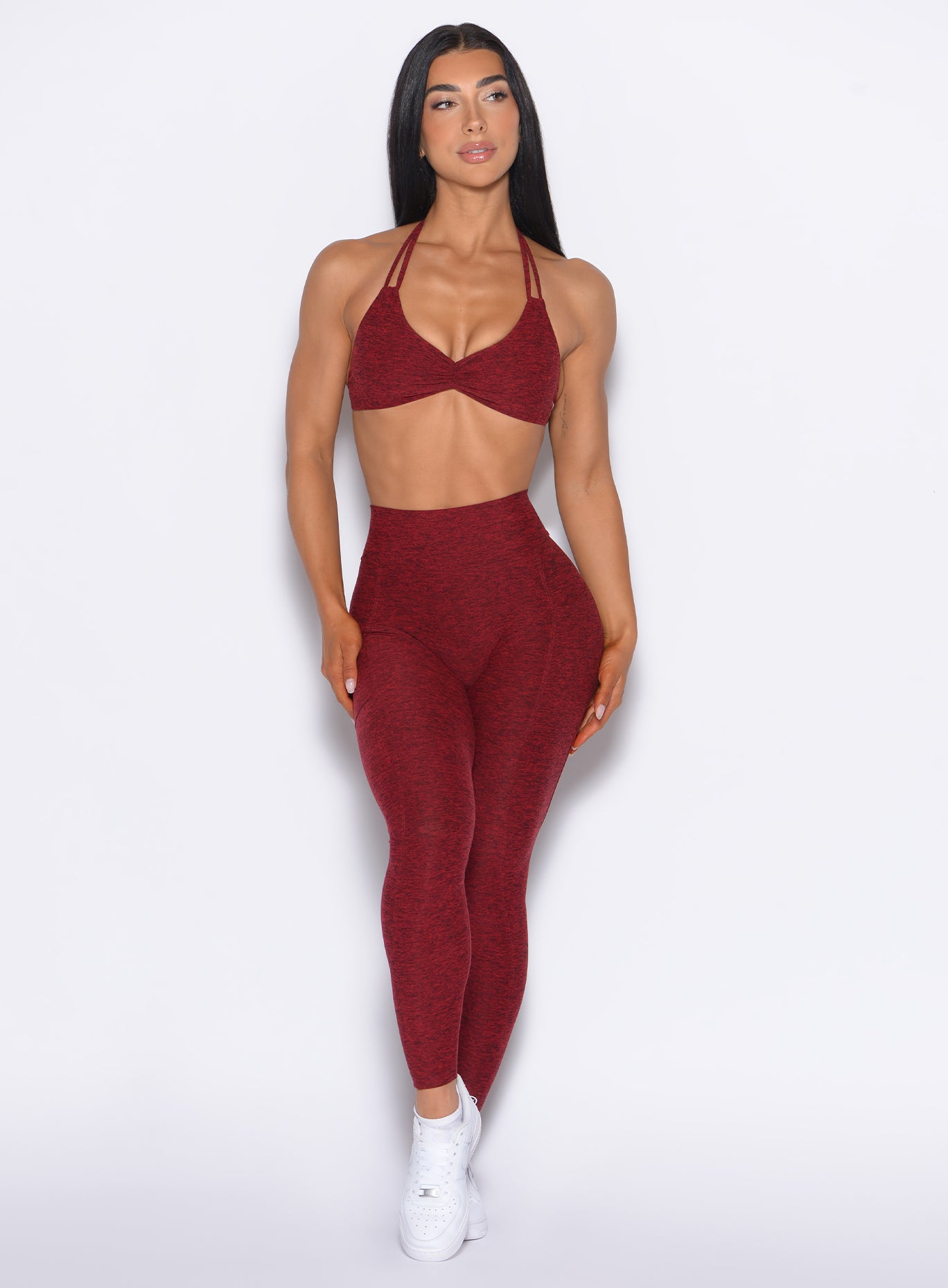 Front profile view of our model looking to the left wearing the Curves 2.0 Leggings in Black Cherry color