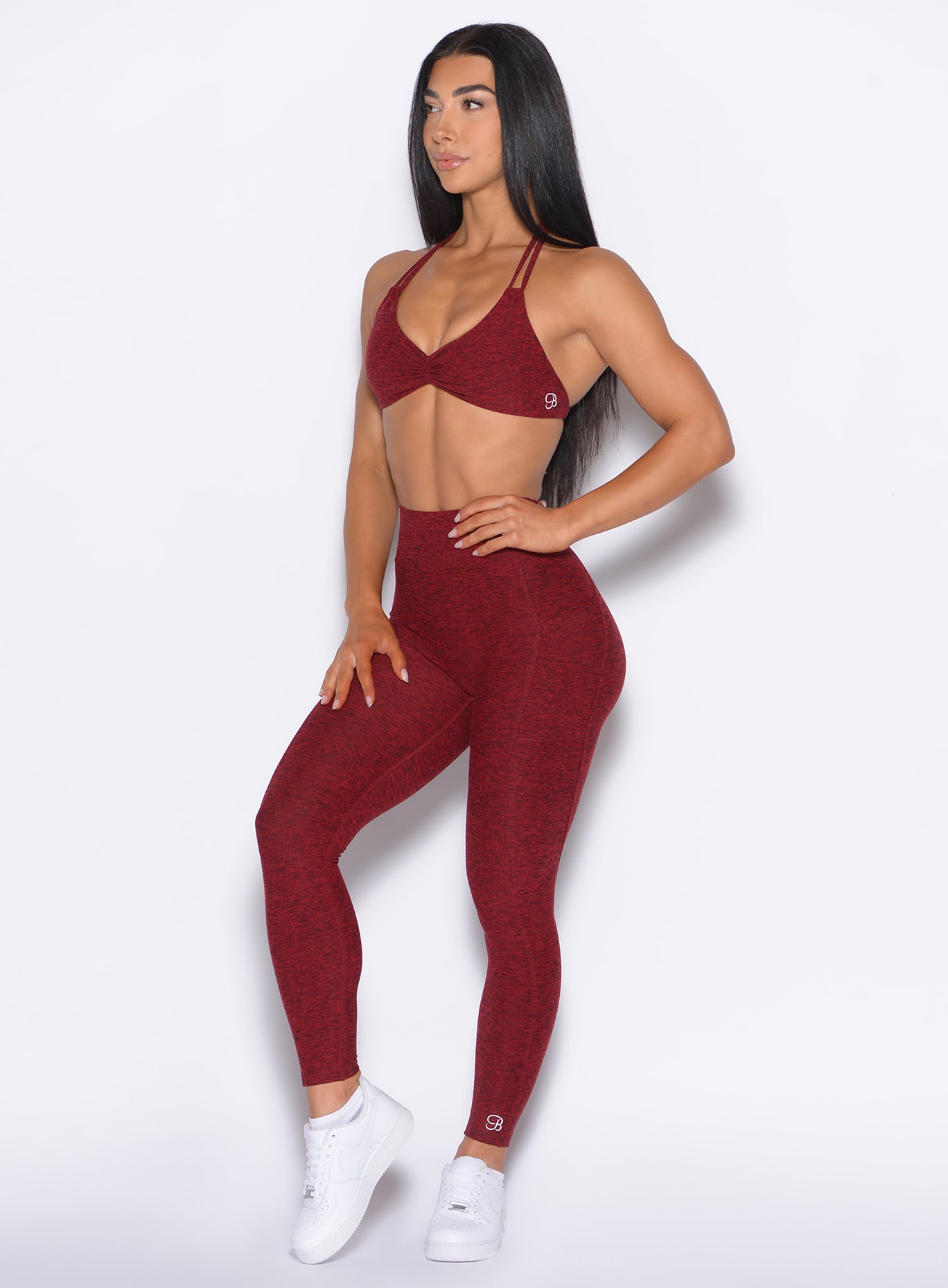 front left side profile view of our model wearing the Curves 2.0 Leggings in Black Cherry color