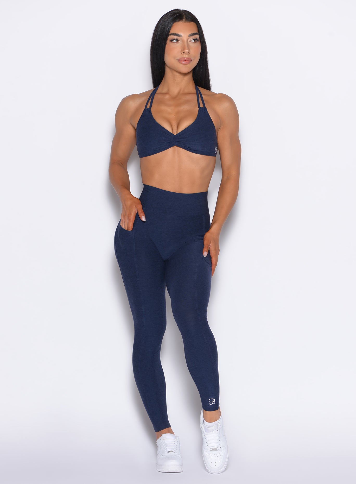 front profile view of our model wearing the Curves 2.0 Leggings in Cosmic Blue color