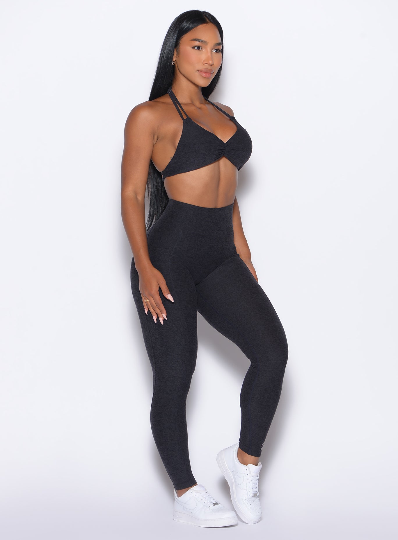 front right side profile view of our model wearing the Curves 2.0 Leggings in Onyx color