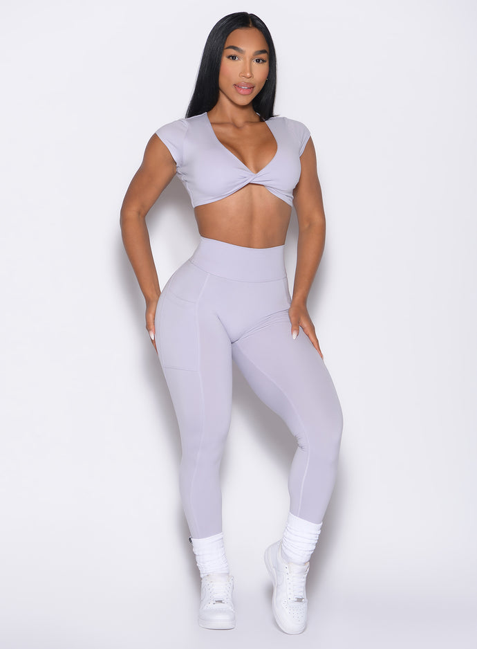 front profile view of a model wearing the Define Leggings in Galactic Lilac color