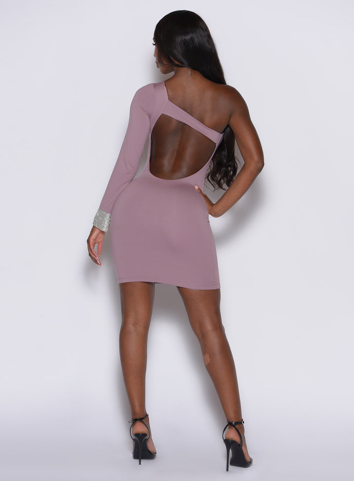 back profile view of a model facing to her left while wearing our diamond dress in light mauve color