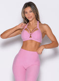 front profile view of a model wearing the Iron Edge Bra in Candy Pink color