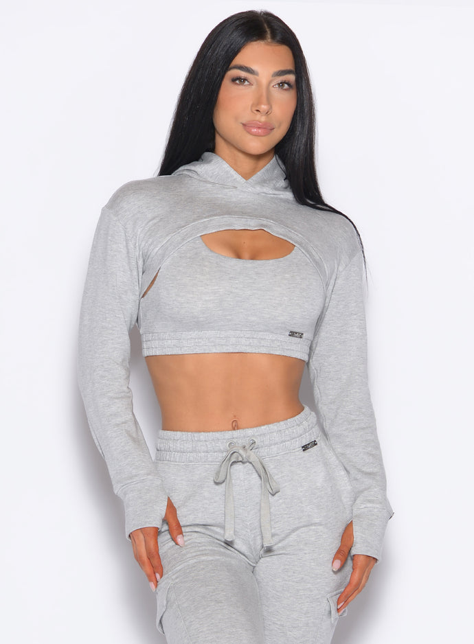 Model facing forward wearing our Sweat Bolero Hoodie and the matching Joggers in Light Heather Grey color