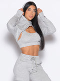 front profile view of a model wearing our Sweat Bolero Hoodie and the matching Joggers in Light Heather Grey color