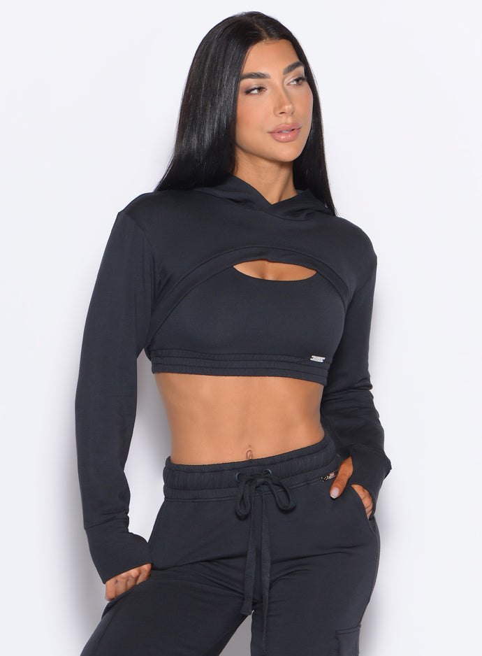 front profile view of a model wearing our Sweat Bolero Hoodie and the matching Joggers in Vintage Black color