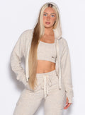 front profile picture of a model in our Sweat Hoodie and the matching Joggers in Heathered Oatmeal color
