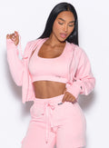 front profile view of our model wearing the Sweat Hoodie in tickled pink color