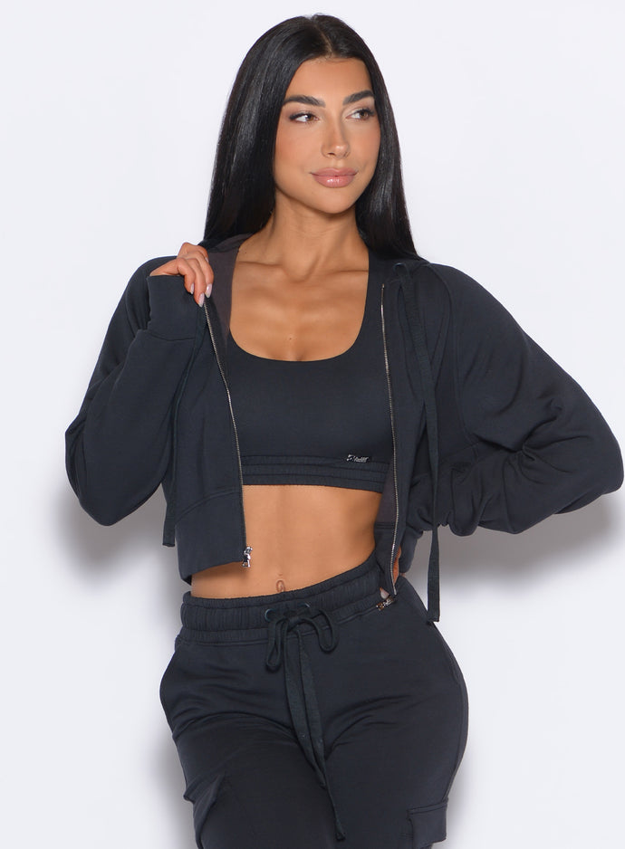 Model facing forward wearing our Sweat Hoodie and the matching Joggers in Vintage Black color