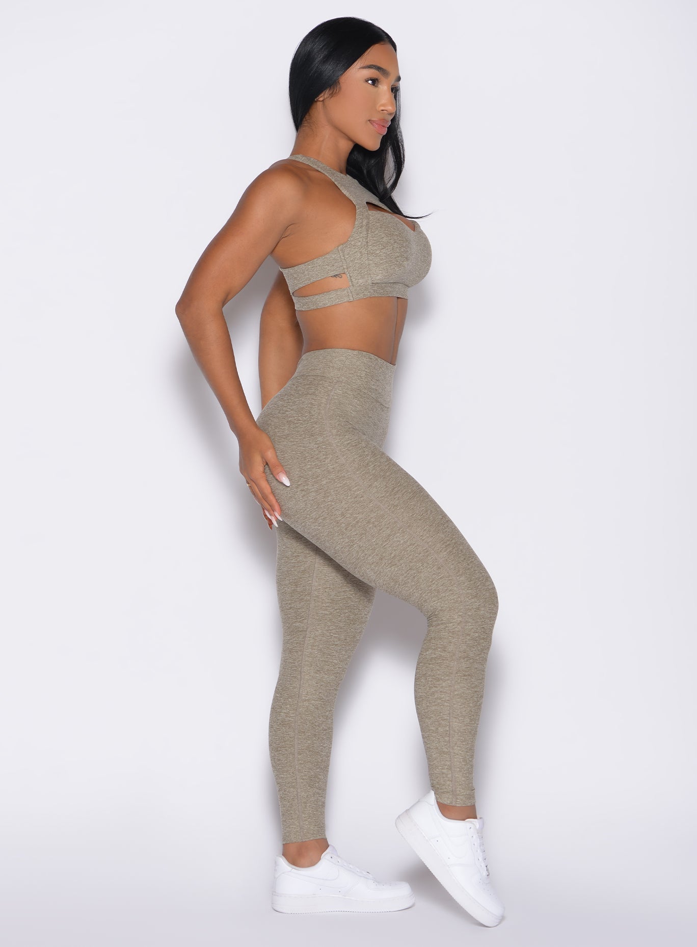 right side profile view of a model  wearing the V Butt Lift Leggings in Toasted Sugar color