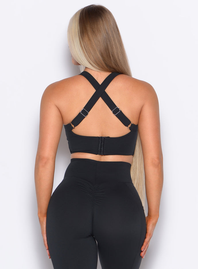 Back side close up view of model wearing the High Impact Bra in Black color and the matching leggings
