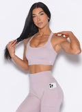 front profile picture of a model in our High Impact Bra in Violet Ice color and the matching leggings
