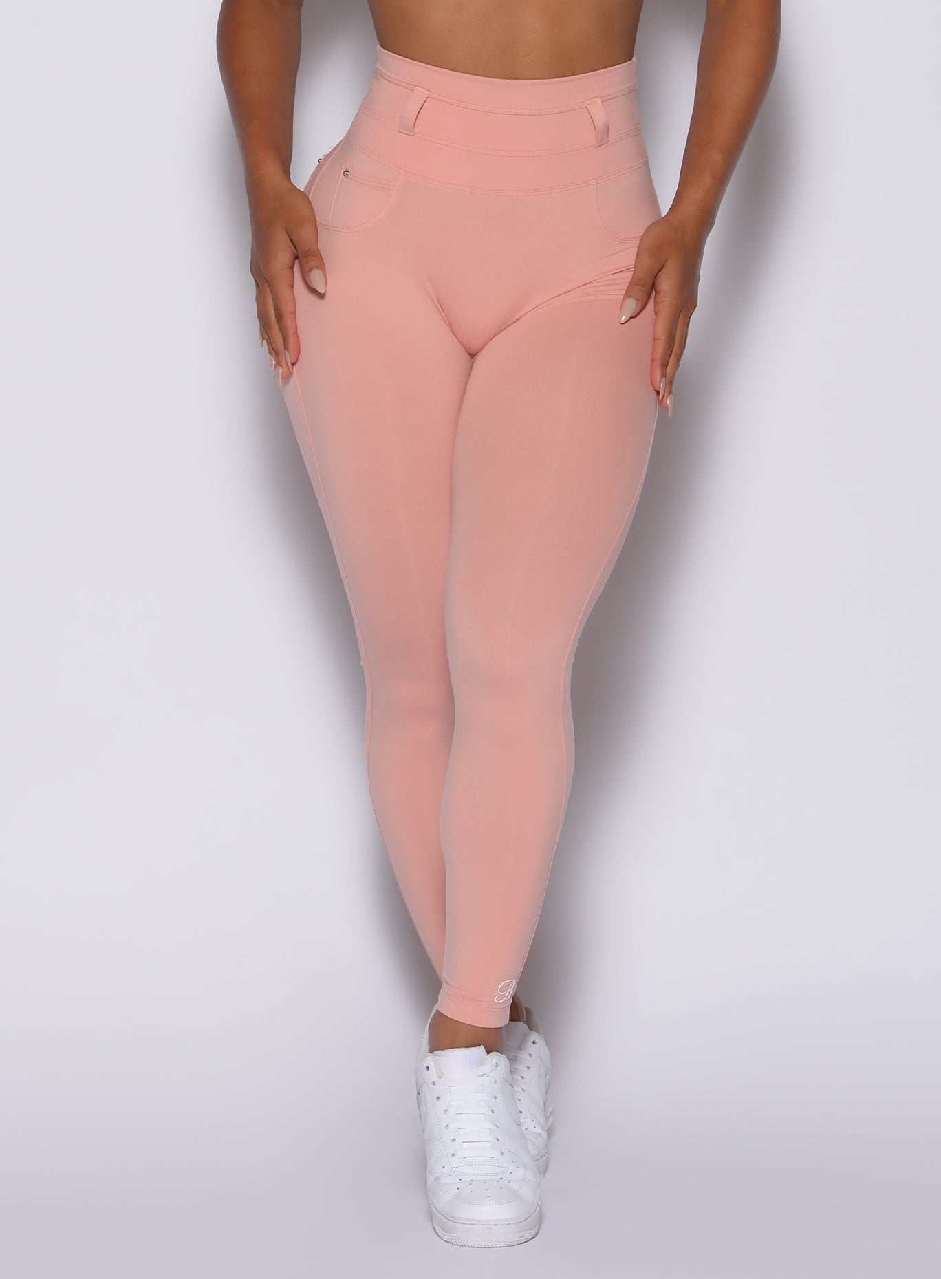 zoomed in front view of our peach bottoms leggings in pale blush color 