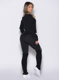 back right side profile view of a model wearing the Internal Scrunch Leggings in black color paired with the matching pullover 