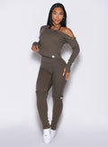 front profile view of a model wearing the Internal Scrunch Leggings in winter oak color paired with the matching pullover