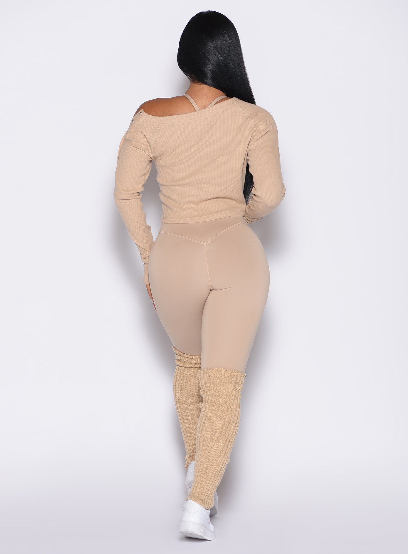 back profile view of a model wearing the Internal Scrunch Leggings in Glacial beige color