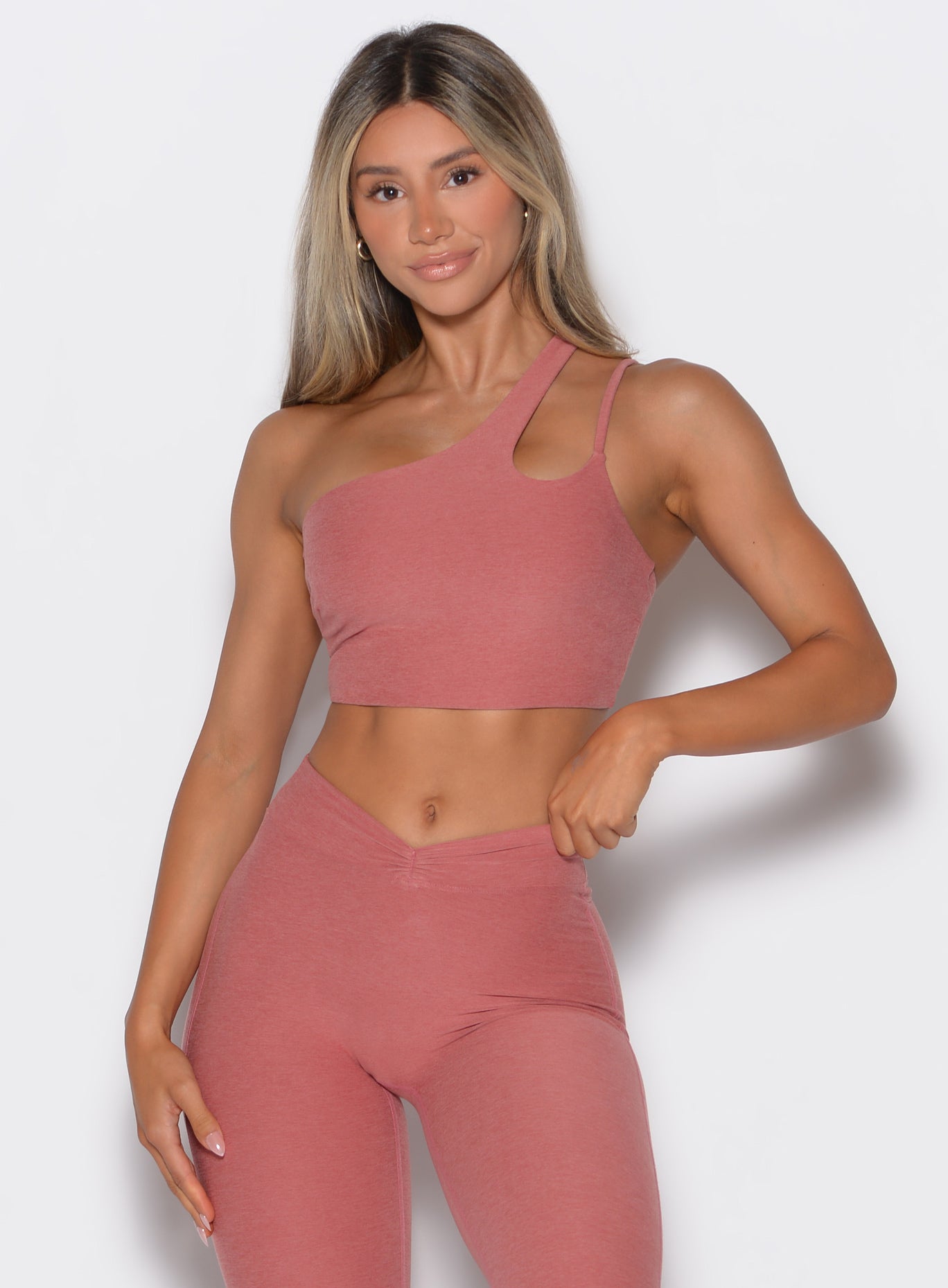 Model facing forward wearing our Lateral Top and the matching leggings in Sedona Clay color