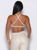 back profile view of our model wearing the Liquid Kini Bra in champagne color