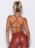 back profile view of our model wearing the Liquid Kini Bra in brick red color