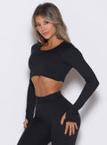 front left side profile view of our model wearing the Bombshell Active Pullover in Black color