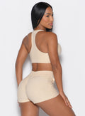 Back right side profile view of our model wearing the Cloud Lounge Bra in vanilla color