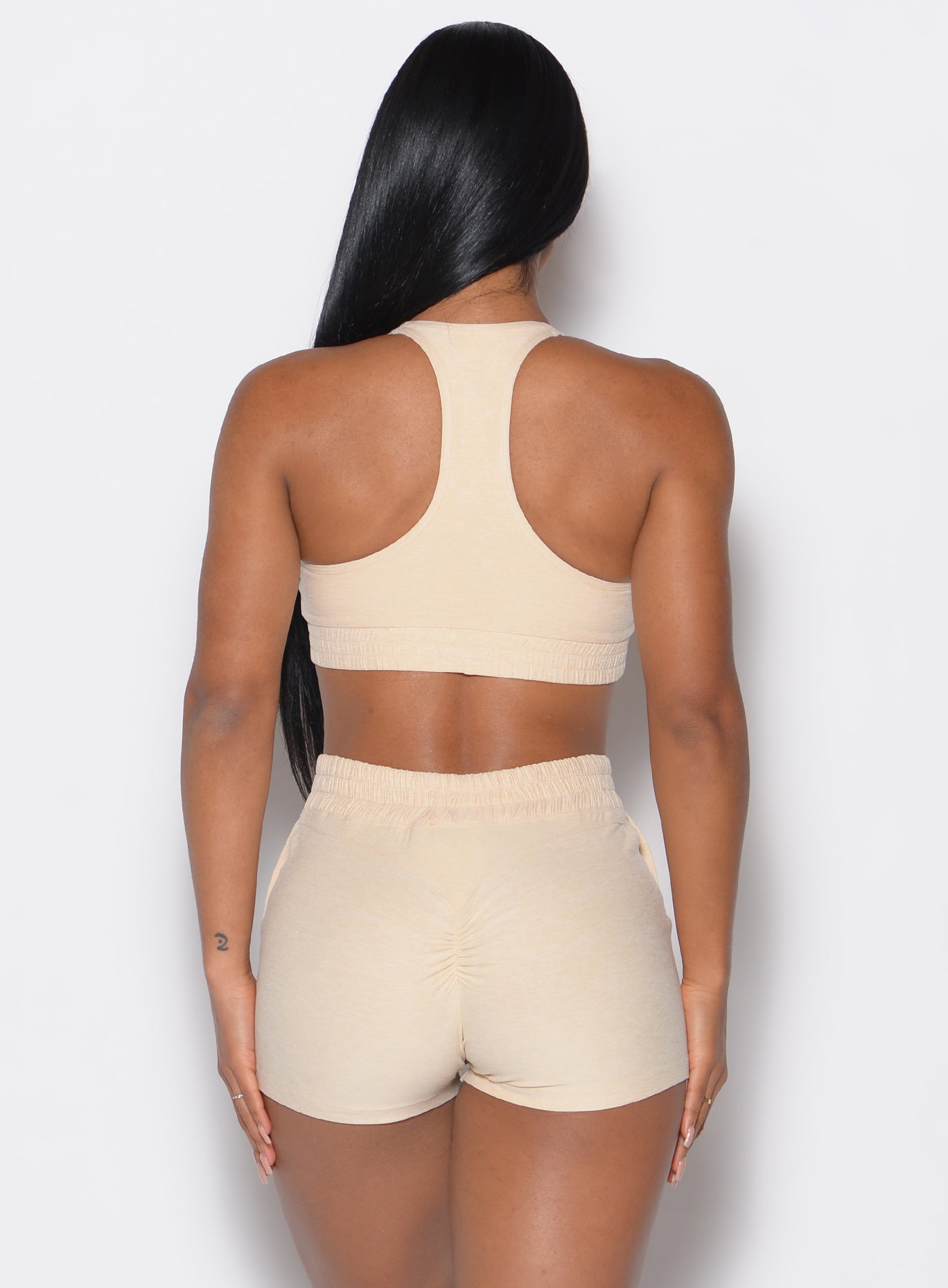 Back profile view of our model wearing the Cloud Lounge Bra in vanilla color