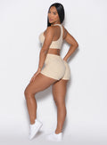 back left side profile view of our model wearing the Cloud Comfort Shorts in vanilla color