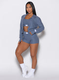 front profile view of our model with one hand on her thigh wearing our Cloud Comfort Shorts in twilight color