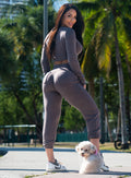 back profile view of a model in outdoors wearing the Cuddle Up Joggers in Cozy chocolate color