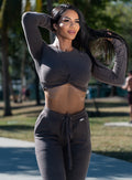 front profile view of a model in outdoors wearing the Cuddle Up Joggers in Cozy chocolate color