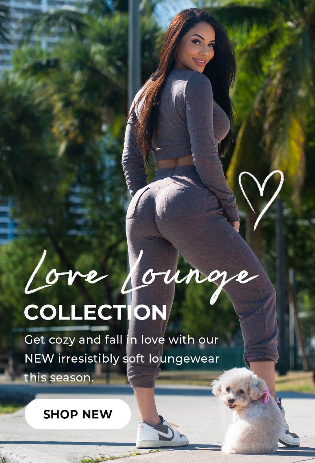 Back view of model in the chocolate brown cropped sweater set with small white dog on the floor. Text on the image reads "Love Lounge Collection et cozy and fall in love with out NEW irresistibility soft loungewear this season." SHOP NEW