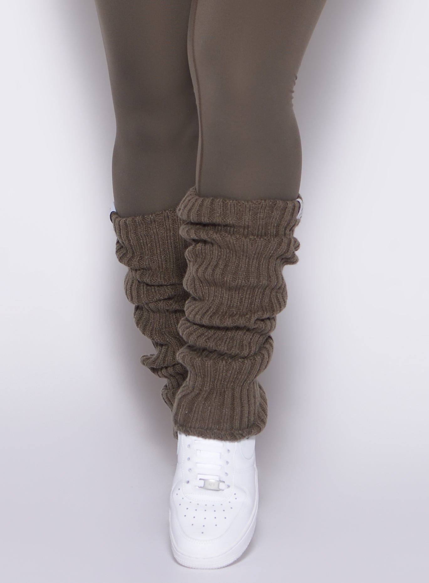 close up front profile shot of a model wearing the Luxe Leg Warmers in Winter oak color