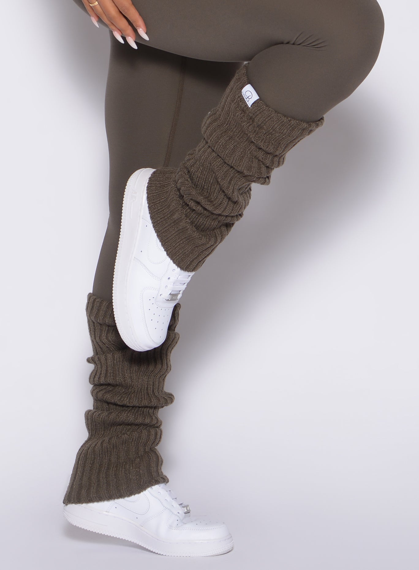 close up right side view of a model wearing the Luxe Leg Warmers in Winter oak color