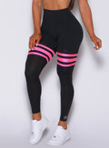 Zoomed in front profile view of our scrunch thigh high with neon pink stripes on the thighs 