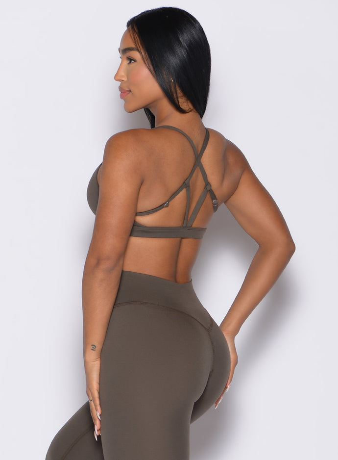 back left side profile view of a model wearing the Passion Sports Bra in winter oak color